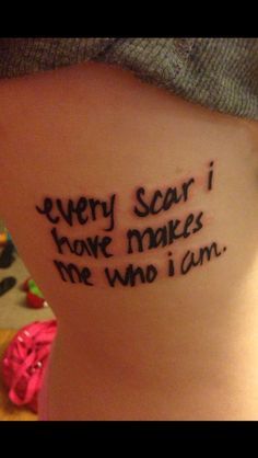 a woman with a tattoo saying every scar i have makes the who i can't