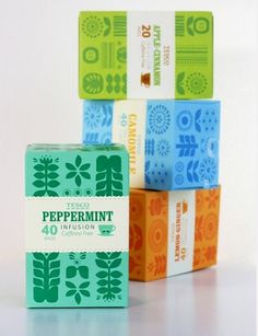 four soap bars stacked on top of each other in different colors and designs, with one bar labeled peppermint