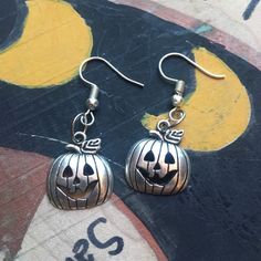 ✨Elegant and simple pumpkin charm earrings.  ✨They measure about 1 inches  Questions? Send me a message! ❤ Shipping & Payment Policies:; https://www.etsy.com/shop/VenaRicoDesigns/policy?ref=shopinfo_policies_leftnav To add gift wrap to your order, click the link below:; https://www.etsy.com/listing/151186034/gift-wrap-your-purchase Spooky Nickel-free Silver Earrings, Spooky Silver Nickel-free Earrings, Adjustable Nickel-free Earrings For Halloween, Hypoallergenic Drop Earrings For Halloween, Spooky Nickel-free Earrings For Halloween, Spooky Silver Dangle Earrings, Nickel-free Silver Earrings For Halloween, Silver Spooky Halloween Earrings, Halloween Dangle Jewelry With Matching Earrings