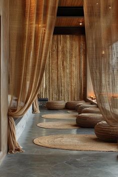 a room with round rugs and sheer curtains