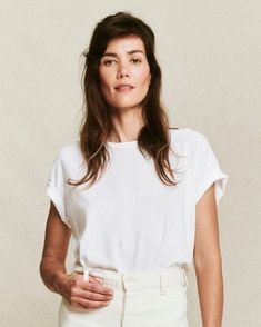 Designed after one of our most cherished vintage tees, this is bound to become your favorite too. This tee is cut generous throughout the body, but with flattering tweaks like angled sleeves and a not too long length. 100% Cotton Machine Wash Cold Tumble Dry Low Made in the U.S.A. Boxy White Everyday Top, Everyday White Boxy Top, Everyday Boxy White Top, White Tops With Rolled Sleeves For Everyday, Emily And Meritt, Chain Stitch Embroidery, Custom Embroidery, Too Long, Chain Stitch