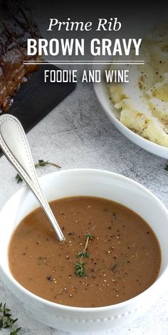 a white bowl filled with brown gravy next to a plate of mashed potatoes