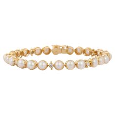 This Genuine 22.8 Carat Pearl and Diamond Tennis Bracelet in 18k Yellow Gold in 18K gold showcases endlessly sparkling natural pearl, weighing 22.8 carat and diamonds weighing 0.05 carats. It measures 7 inches long in length. Pearl symbolizes purity, determination and perfection. Designed with perfect round cut pearl set in gold with diamonds in between to make you stand out on any occasion or event. The elegant style complements the attire beautifully and is a perfect June Birthstone Bracelet. Pearl Tennis Bracelet, Luxury Pearl Bracelet With Diamond Accents, Elegant Pearl Bracelet With Diamond Accents, Elegant Gold Bracelet With Single Cut Diamonds, Luxury White Pearl Bracelet With Diamonds, Luxury White Gold Pearl Jubilee Bracelet, Luxury White Diamond Pearl Bracelet, Classic White Gold Diamond Pearl Bracelet, Timeless White Gold Pearl Bracelet For Anniversary