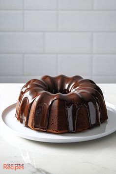 a chocolate bundt cake on a white plate