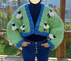 Sheep Knit Jacket, Christmas Gift, Oversized Cardigan, Green Crop Cardigan, Handmade Chunky Cardigan, Fluffy Crop Jacket, Fluffy Cardigan, Oversized Sweater, 3D Sheeps Model heigh: 1.60 cm weigh: 50 kg Size: S-M-L/36-38-40 Cardigan size: Fit most size This cardigan is 100% handmade & made by 100% merino wool yarn for you ! The sheeps on it are 100% micropolyester. You can request it with different colors. Please inform me before making an order if you want different colors or write on personaliz Green Chunky Knit Winter Cardigan, 3d Cardigan, Green Crop Cardigan, Crochet Sheep Cardigan, Jacket Fluffy, Sheep Cardigan, Chunky Flower Cardigan, Cardigan Handmade, Fluffy Cardigan