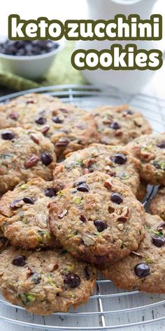 several cookies on a cooling rack with the words keto zucchini cookies