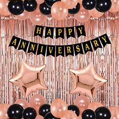 balloons and streamers with the words happy anniversary in black, gold and pink colors