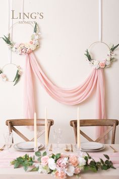 the table is set with flowers and candles