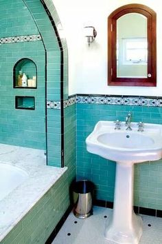 a bath room with a sink a mirror and a bath tub inside of it's walls