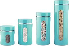 three blue canisters with cereal in them and one has a lid on it