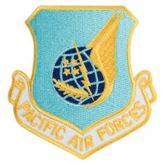 an air force emblem with the words pacific air forces on it's back side