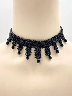 Dear customers, for a price offer of expedited shipping outside of Germany, please contact me directly via Etsy messages. A Gothic Victorian beaded choker with sparkling black crystal drops, made for your dress for gothic carnival or any classy goth look. Goth fashion is distinguished by darkness, mystery, elegant wardrobe pieces and, smoky makeup even though it may surprise some that not all Goths always wear black. It's said that all Goths have the desire to stand out in a society considered t Elegant Black Beads Choker As Gift, Elegant Black Beads Choker For Gift, Handmade Crystal Choker Necklace For Party, Adjustable Black Crystal Necklaces For Parties, Black Crystal Beaded Party Necklace, Black Crystal Beaded Necklaces For Party, Formal Black Bead Choker Jewelry, Elegant Beaded Crystal Choker Necklace, Elegant Black Choker With Round Beads