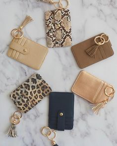 six different purses on a marble surface