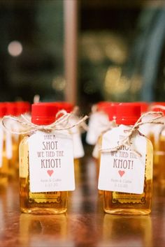 honey jars with labels on them sitting on a table