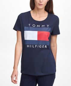 Show some love for the logo with this iconic cotton tee by Tommy Hilfiger. Relaxed Fit Crew Neck Top With Front Logo, Graphic Tee With Front Logo And Crew Neck, Cotton Crew Neck Tops With Front Logo, Sporty Short Sleeve Tops With Front Logo, Cotton Tops With Front Logo And Relaxed Fit, Graphic Tee With Front Logo, Sporty Crew Neck Top With Front Logo, Sporty Relaxed Fit Top With Front Logo, Relaxed Fit Flag Print Crew Neck Top