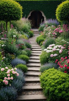 an outdoor garden with steps leading up to the entrance and flowers growing all around it