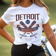 Please read the description completely and review all photos before ordering. Our Detroit Baseball Apparel is the perfect way to cheer on the home team this season. Ideal for game day, tailgates or everyday wear. Makes a great gift for any fan. This listing is for the distressed design. Click the link below for the non-distressed version: https://tandtapparel21.etsy.com/listing/1672213846/vintage-style-detroit-baseball-t-shirt SHIRT DETAILS Bella Canvas Unisex - Solid colors: 100% Cotton. - Heather colors: 52% Cotton + 48% Polyester - Runs true to size. (For looser or oversized fit consider going up a size or 2. See photos for size chart.) SWEATSHIRT & HOODIE DETAILS Gildan Heavy Blend Unisex - 50% Cotton + 50 Polyester - Runs true to size. (For looser or oversized fit consider going up a Baseball Apparel, Hoodie Details, Baseball Outfit, Sports Hoodies, Baseball Fan, Home Team, Sweatshirt Hoodie, Baseball Tshirts, Game Day