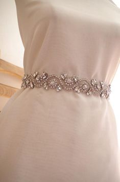 a bridal belt is displayed on a mannequin