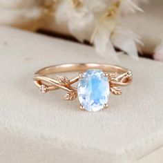 Experience the beauty of nature with our Natural Oval Cut Moonstone Engagement Ring. It's a symbol of timeless love and the allure of moonlight. Ethereal Oval Moonstone Promise Ring, Ethereal Oval Moonstone Ring For Anniversary, Ethereal Oval Moonstone Ring, Ethereal Oval Moonstone Ring For Wedding, Ethereal Oval Moonstone Wedding Ring, Ethereal Oval Rings For Anniversary, June Gemstone, Branch Engagement Ring, Moonstone Engagement