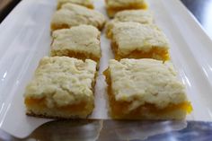 several squares of food on a white plate