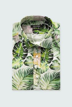 Invite the fun of the tropics into your wardrobe when you explore the qualities of this cotton-spandex shirt. A dynamic print that can be paired with your favorite solid suit of striped trousers if you're feeling bold. Tropical Print Cotton Shirt, Cotton Tropical Print Shirt, Tropical Multicolor Cotton Shirt, Patterned Cotton Shirt With Tropical Print, Green Cotton Shirt With Tropical Print, Tropical Patterned Cotton Shirt, Tropical Cotton Shirt For Spring, Spring Tropical Cotton Shirt, Green Tropical Printed Shirt