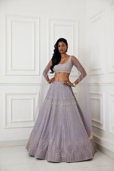 Lilac organza lehenga with glass beads, zardozi and pearl embellishments paired with raw silk embroidered blouse with long tulle cape sleeve.From Chamee and Palak's The Romantics collection.DELIVERY TIMEPlease allow 8-12 weeks for your outfit to arrive.FABRIC DETAILSOrganza, Silk, NetProfessional cleaning only. Organza Choli With Cape Sleeves And Zari Work, Organza Choli With Zari Work And Cape Sleeves, Organza Anarkali Choli With Cape Sleeves, Fitted Lehenga With Resham Embroidery And Cape Sleeves, Festive Organza Lehenga With Cape Sleeves, Organza Choli With Cape Sleeves For Reception, Anarkali Lehenga With Zari Work And Cape Sleeves, Anarkali Set With Intricate Embroidery For Reception, Traditional Anarkali Set With Intricate Embroidery And Cape Sleeves