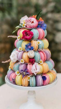 macaroons are stacked on top of each other in the shape of a tower