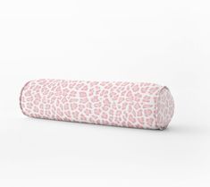 a pink and white leopard print roll pillow on a white background, with the top half rolled up