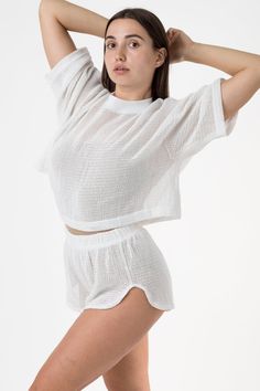 The Cotton Fishnet Shorts are cut in a classic Dolphin short silhouette, with high leg openings on the sides and an elasticized waistband. Our cotton mesh fabric is knit locally to be breathable and lightweight, making it a universal summer staple. For a monochromatic look, we recommend wearing the RIN401GD Cotton Fishnet Mock Neck T-Shirt in a matching color. This item can also be layered with any of our swimsuits, intimates, performance wear, or bodysuits. Great for lounging, sleeping, water a Fishnet Shorts, Mock Neck And T Shirt, Los Angeles Apparel, Garment Manufacturing, Dolphin Shorts, Performance Wear, Sweaters And Leggings, High Leg, Girls Jeans