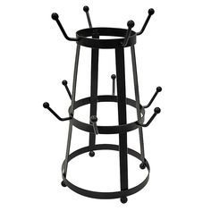 a black metal stool with four bars on the top and two holes in the bottom