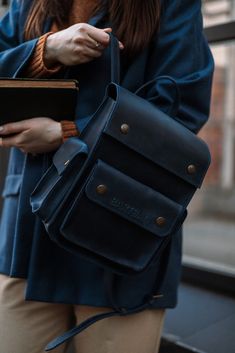 Model INGI Dark Blue Crazy Horse Leather Women's Backpack: Small Daily Pack and City Rucksack Elevate your style with our Dark Blue Crazy Horse Leather Women's Backpack. Crafted from premium Crazy Horse leather, this backpack boasts a vintage finish that gets better with time. It's designed to be your ideal companion for city adventures, daily commutes, and casual outings. Features: * Premium Leather: Made from high-quality dark blue Crazy Horse leather, ensuring durability and a unique, vintage look. * Compact Size: Perfect for daily use with dimensions of 20 x 25 x 12 cm, offering ample space without being bulky. * Multiple Compartments: Organized storage with several pockets to keep your essentials neatly arranged. * Comfortable Carry: Adjustable straps provide a comfortable fit for all Leather School Backpack With Luggage Sleeve, Blue Backpack For Everyday Use And Back To School, Casual Blue Rectangular Leather Backpack, Blue Rectangular Leather Backpack, Adjustable Strap Leather Backpack For Students, Blue Travel Backpack With Pockets, Blue Standard Backpack For Travel, Large Capacity Blue Leather Backpack, Blue Travel Backpack