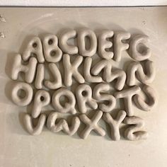 the letters and numbers are made out of clay