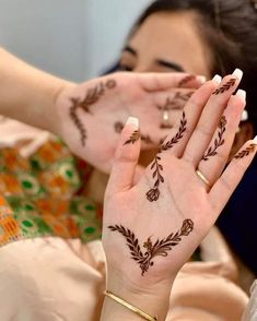 a woman with henna on her hands