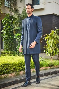 Navy blue double paneled jacket style bandhgala with pintucked details on front. Comes with coordinating pant. - Aza Fashions Elegant Long Sleeve Sets With Pintucks, Traditional Sets With Pintucks For Eid, Traditional Eid Sets With Pintucks, Designer Tailored Kurta For Semi-formal Occasions, Tailored Long Sleeve Bandhgala For Designer Wear, Tailored Bandhgala For Semi-formal Eid Occasions, Tailored Long Sleeve Bandhgala For Eid, Elegant Fitted Sets With Pintucks, Blue Nehru Jacket For Festive Workwear