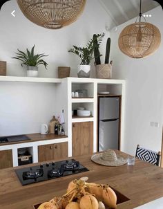 some bananas are sitting on a table in the kitchen