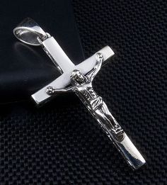 SMALL STERLING SILVER JESUS PENDANT ~NEW  high-grade sterling silver;  we molded and polished this product by hand;  925 hallmark stamp on the back;  Pendant’s weight: 10 grams;   Pendant’s size: 27 mm x 60 mm (1” x 2.3”);  Necklace is not included.   Crosses and crucifixes are not only for Christians. Today, those symbols took one step away from religion and gained rather a cultural meaning. Finding a pride of place in Gothic fashion, crosses are no longer taboo. If you like this symbol, why no Classic Silver Crucifix Jewelry, Cross Wallpaper, Cross Jesus, New Years Sales, Jesus On The Cross, Silver Chain Necklace, Silver Cross, Fine Jewellery Necklace, Gothic Fashion