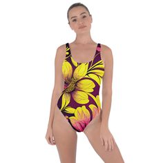 Unleash your beachside radiance with the Sunshine Blooms Bring Sexy Back Swimsuit by Mila Beachwear. This captivating piece features a vibrant floral print inspired by sunshine blooms and a daring open-back design, ensuring you make a bold and stylish statement at any beach or poolside gathering. Crafted from high-quality, quick-drying fabric, this swimsuit offers exceptional comfort, flexibility, and durability. The open-back design creates a chic, flattering silhouette that exudes confidence and sophistication. Elevate your swimwear collection with the Sunshine Blooms Bring Sexy Back Swimsuit by Mila Beachwear. With its vibrant design and striking details, this swimsuit is perfect for the confident beachgoer who loves to make a fashionable statement. Tropical Floral Print Bodysuit For Beach, Multicolor Floral Print Swimwear For Surfing, Floral Print Beachwear Bodysuit For Beach, Floral Print Bodysuit For Beach, Floral Print Beachwear Bodysuit, Floral Print Bodysuit For The Beach, Tropical Floral Print Bodysuit For Vacation, Floral Print Bodysuit For Swimming And Beach Season, Floral Print Bodysuit For Beach Season Swimming