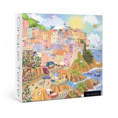 a puzzle box with an image of a city on the beach and boats in the water