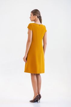 "A midi mustard dress featuring a line silhouette, draped bodice and cap sleeves. - draped bodice - a line silhouette - cap sleeves - scoop neck - knee length (midi) - two pockets in side seams - premium italian fabric Color: yellow (mustard) Fiber: viscose - 60%, elastan - 5%, polyester - 35% Concealed back zipper closure For Size S (6 US): dress length - 39\" (101,5 cm) Our model wears size S (US 6) and is 171 cm/5'6\" tall. You may feel free choosing the size. Just send us your measurements ( Gold Fitted A-line Midi Dress, Gold Knee-length Midi Dress, Yellow Elegant Dress With Pleated Bodice, Yellow A-line Midi Dress For Evening, Yellow Short Sleeve Dress For Formal Events, Yellow Short Sleeve Formal Dress, Elegant Yellow Short Sleeve Midi Dress, Yellow Short Sleeve Midi Dress For Evening, Gold Midi Dress For Workwear