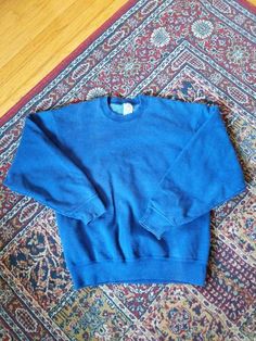 "Vintage Munsingwear Super Cotton Blue Sweatshirt, size medium. In very good used condition! MEASUREMENTS ----------------------- Length: 25.5\" Shoulders: 20.5\" Pits: 21.5\" Shoulder to wrist: 21.25\"" Vintage Winter Sweats With Relaxed Fit, Vintage Relaxed Fit Winter Sweats, Vintage Relaxed Fit Sweats For Winter, Vintage Blue Crew Neck Sweater, Vintage Blue Cotton Sweatshirt, Blue Vintage Cotton Sweatshirt, 90s Style Blue Cotton Sweater, 90s Blue Cotton Sweater, Blue 90s Style Sweatshirt For Fall