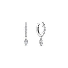 An everyday essential & best seller for a reason. This mini huggie earring is crafted with a row of sparkling pavé cz diamonds and accented with a single diamond teardrop that hangs delicately off the ear. Size: Inner Diameter 8mmStone: Cubic ZirconiaMaterials: Sterling Silver & 14K Gold Vermeil Single Teardrop Diamond Earring, Fine Jewelry Teardrop Huggie Earrings With Diamond Accents, Teardrop Huggie Earrings With Diamond Accents, Everyday Teardrop Diamond Earrings With Accents, Everyday Teardrop Huggie Earrings, Everyday Cubic Zirconia Teardrop Earrings, Everyday Teardrop Cubic Zirconia Earrings, Diamond Teardrop Huggie Earring, Everyday Teardrop White Gold Huggie Earrings