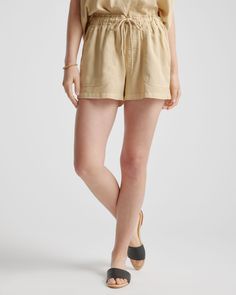 Made from a soft, drapey fabric, these shorts feature angled front and back patch pockets. P.S. they pair perfectly with the camp shirt. Lyocell is a biodegradable fabric made from cellulose found in wood pulp. It is softer, more breathable, and uses 10-20 times less water in production compared to cotton.  | Quince | Women's Vintage Wash Utility Shorts in Light Khaki, Size Large, Tencel Utility Shorts, Open Sleeves, Silk Cami, Quarter Zip Sweater, Camp Shirt, Cute Sets, Just Run, Linen Shorts, Camping Shirt