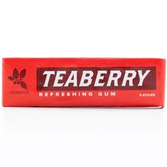 a tube of teaberry chewing gum on a white background