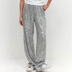 Shine bright in the Shona Metallic Sequin Wide Leg Pants! Choose between shimmering gold and silver and show off your unique style. Perfect for any party or casual fashionista style, these wide-leg pants are a statement-making piece. Get ready to glitter the night away! 🤩 Gender: WOMEN Item Type: Pants, Trousers, Wide Leg Pants Waist Type: MID Material: Polyester Elasticity: Slight Stretch, Semi Sheer Decoration: Bright silk Decoration: Spliced, Sequined Closure Type: Elastic Waist SIZE CHART S Sequin Wide Leg Pants, Party Trousers, Sequin Joggers, Sequin Jogger Pants, Joggers Pants, Trouser Pants, Long Pants, Jogger Pants, Fashion Pants