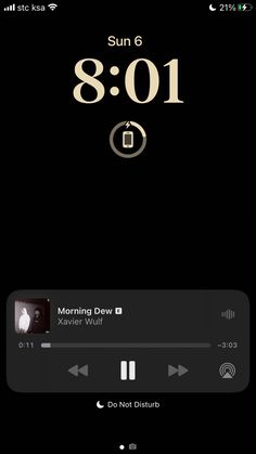 an iphone screen with the clock displayed on it's display and music player running