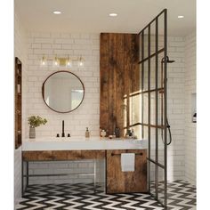 a bathroom with black and white checkered flooring, a mirror above the sink