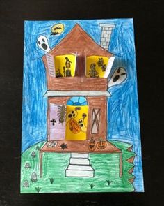 a child's drawing of a house with halloween decorations on the front and side