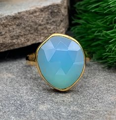 "Modernist 14k Yellow Gold Sterling Silver Aqua Blue Chalcedony Hammered Band Ring Size 8 Up for offer is a modernist 14k yellow gold vermeil over solid sterling silver hammered band and rose cut aqua blue chalcedony ring.  Ring is marked \"925\". Measurements Ring Size: 8 Aqua Blue Chalcedony: 17mm x 13mm x 5mm Band Width: 3mm Weight: 3.8 g Materials -14k Yellow Gold vermeil -Sterling Silver -Aqua Blue Chalcedony Condition: New; Please inspect pictures for overall condition. Quality and accuracy are my goal!  I do my best to describe pieces as best as possible, and I am happy to take additional pictures and answer questions to ensure your satisfaction!  All gemstones are tested using a Presidium Duo Gem Tester, and metals are tested using a rare earth magnet and acid.  I do my best to the Blue Faceted Sapphire Ring In Fine Jewelry Style, Blue Faceted Sapphire Ring Fine Jewelry, Blue Oval Moonstone Ring In 14k Gold, Blue Emerald Birthstone Ring, Blue Moonstone Round Ring Fine Jewelry, Blue Moonstone Ring, Fine Jewelry Gift, Yellow Gold Chalcedony Ring Gift, Blue Round Moonstone Ring In 14k Gold, Blue Chalcedony Round Jewelry