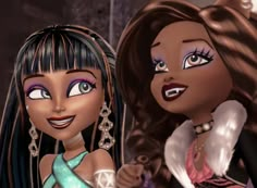 two cartoon dolls are standing next to each other