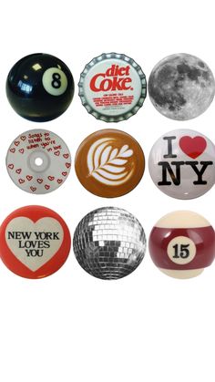 eight ball magnets with i love new york, ny and other cities on them